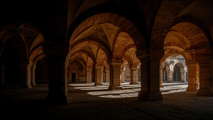 Dramatic interior arches create play of light and shadow