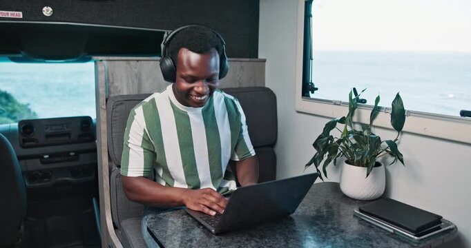 Headphones, dance or black man in caravan with laptop, streaming or listening to song on road trip. Happy, playlist or male person in trailer with tech, album or radio subscription on journey.