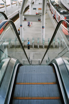 Escalator leading to train station platforms