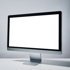 Studio shot of a modern all-in-one desktop computer with a blank white screen for mockup purposes against a gray background