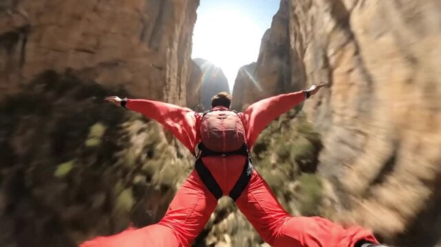 Extreme base jumping adventure by generative ai stunning canyon landscape aerial perspective thrill and innovation