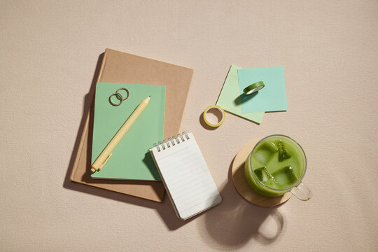 Aesthetic matcha latte, notebooks, and stationery