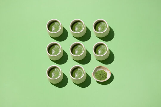 A visually appealing arrangement of matcha tea in small cups