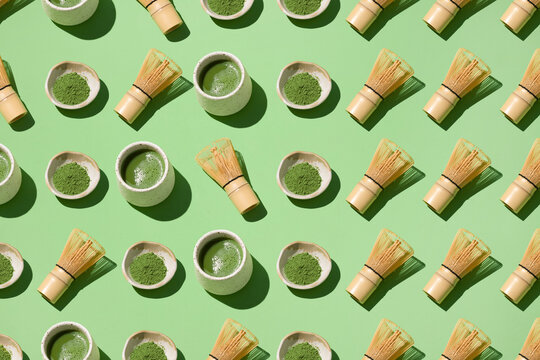A repeating pattern of matcha bowls, whisks, and cups