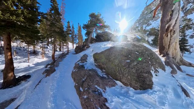 Snow Blows Over Rocks at Foot of Emerald Lake in Rocky Mountain National Park