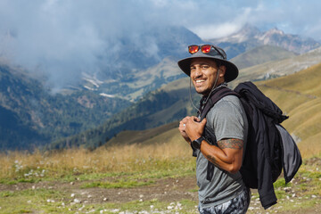 Hiker Enjoys Scenic View in Mountain Landscape During Daytime