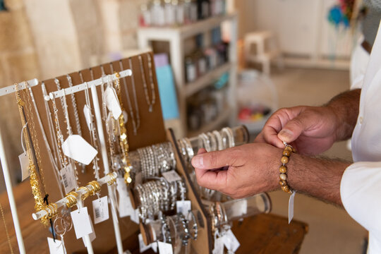 A man tries on a bracelet in a store Jewelry Shopping
