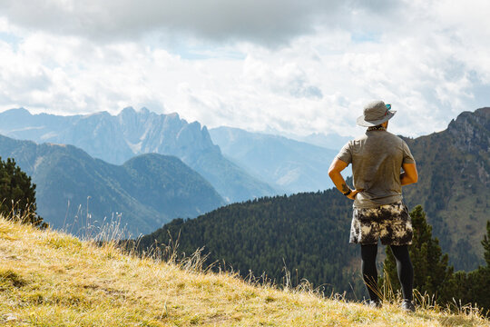 Hiker Enjoying Scenic Mountain View on a Sunny Day