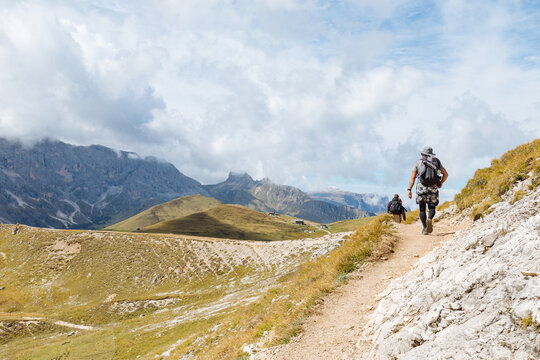 Hikers Exploring Mountain Trails in the Dolomites During Daytime