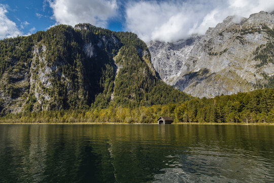 Scenic View of a Tranquil Lake Surrounded by Mountains and Trees