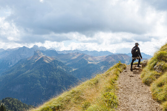 Hiker Explores a Mountain Trail Amid Stunning Alpine Scenery