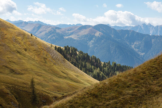 Scenic Mountain Landscape With Rolling Hills and Distant Peaks