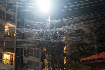 Messy Urban Power Lines at Night