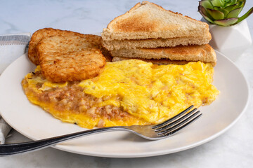 corn beef hash omelette with hash browns