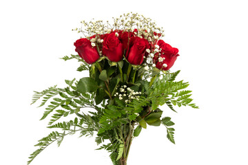 A bouquet of long stem red roses with baby's breath and fern greenery isolated on white