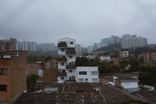 Cityscape view with cloudy skies and urban buildings in the distance
