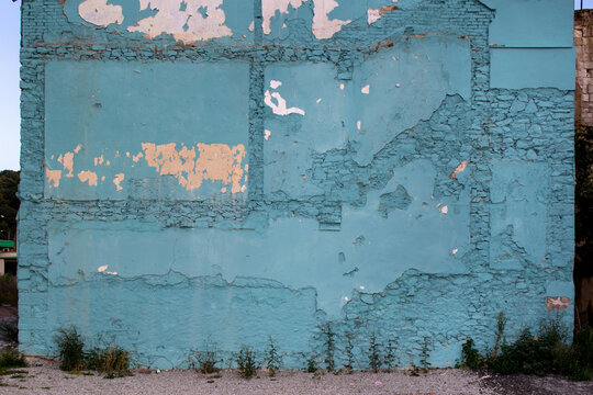 Painted house wall with traces of an old house