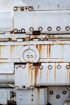 Large machine with rivets and rust spots