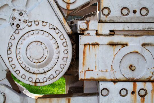 Large machine with rivets and rust spots