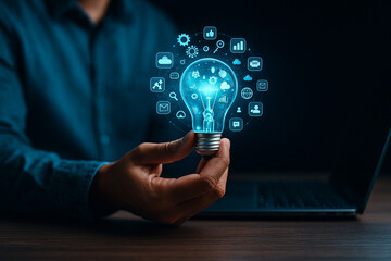 AI generated concept showing a glowing digital light bulb in a hand surrounded by holographic icons representing ideas data technology and creative innovation in a modern futuristic atmosphere