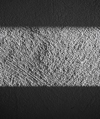 Textured Black and White Wall with Light and Shadow Contrast