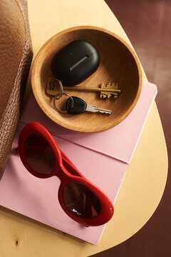 Everyday items arranged on a wooden table