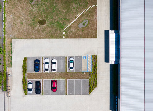 Small Factory Parking Lot with Vehicles Aerial