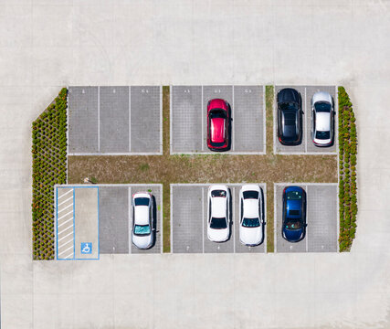 Aerial View of Parking Lot with Cars and Green Borders