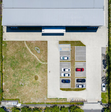 Small Factory Parking Lot with Vehicles Aerial