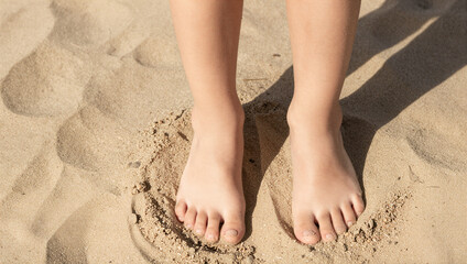 Relaxing on the beach barefoot moments sand footprints coastal environment close-up perspective summer vibes