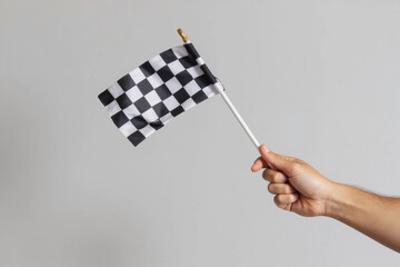 Obraz premium checkered race flag in hand.