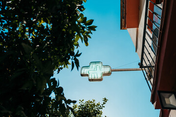 Neon pharmacy sign with trees