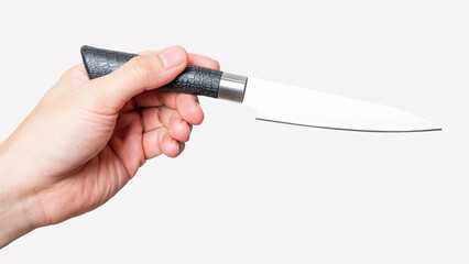 Male hand holding a steel cooking knife isolated on white background.