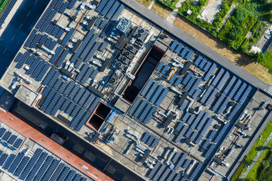 Aerial view of factory roof with solar panels and ventilation systems