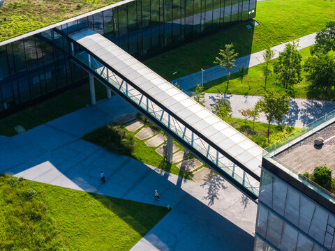 Aerial view of modern glass walkway connecting office buildings