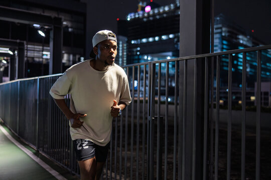 Night runner in city.
