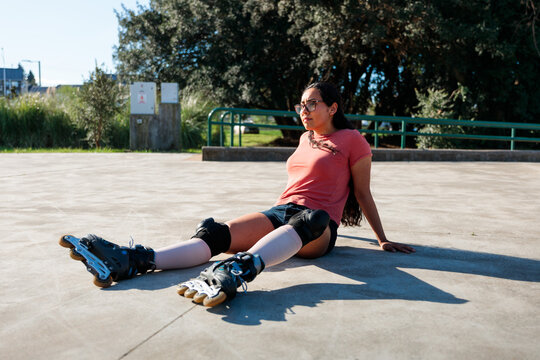 Latina Rollerblader Resting Under the Sun