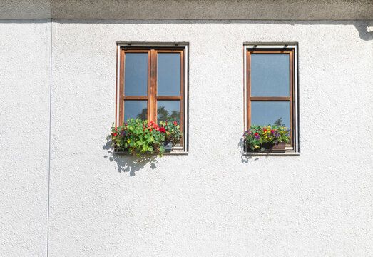 Vibrant Flower Boxes on White Wall