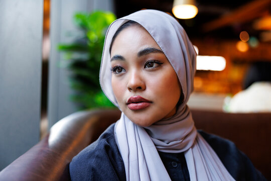 Woman in hijab deep in thought