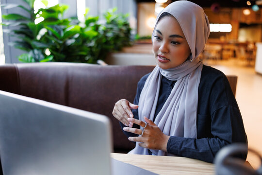 Woman in hijab on conferencing call