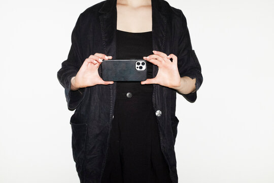 Person wearing formal blazer outfit in business work office with flash