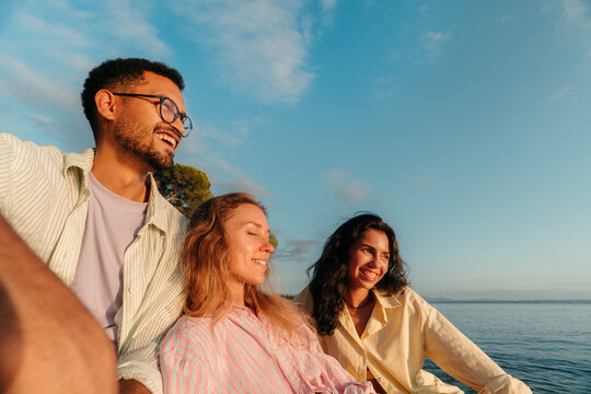 Happy best friends laughing together outdoors