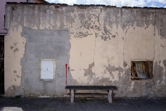 Seating in front of a crumbling wall