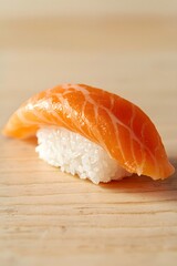 Fresh handcrafted salmon nigiri sushi presented on a clean wooden surface with soft lighting, showcasing premium fish texture and minimalist Japanese cuisine aesthetic