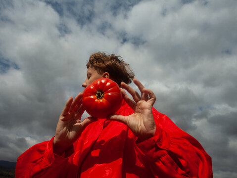 A woman with the tomato 