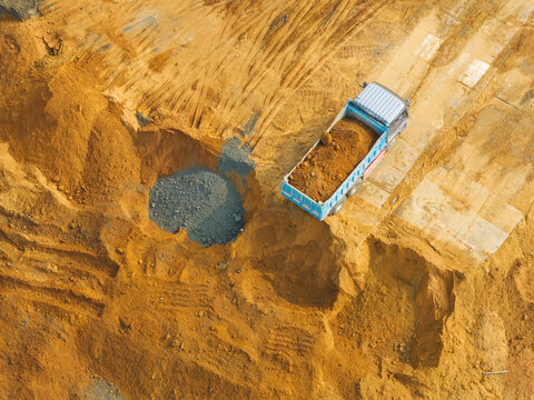 Aerial Construction Site Dump Truck Unloading Soil