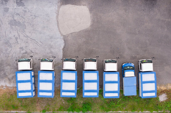 Aerial View of Blue and White Trucks Parked in a Row