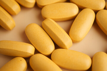 Yellow tablets arranged on a light background