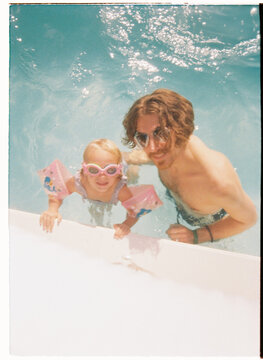 Father and daughter enjoying pool time together