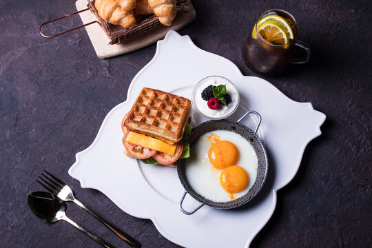 Delicious Brunch Spread With Waffles, Eggs, and Fresh Fruit on a Table